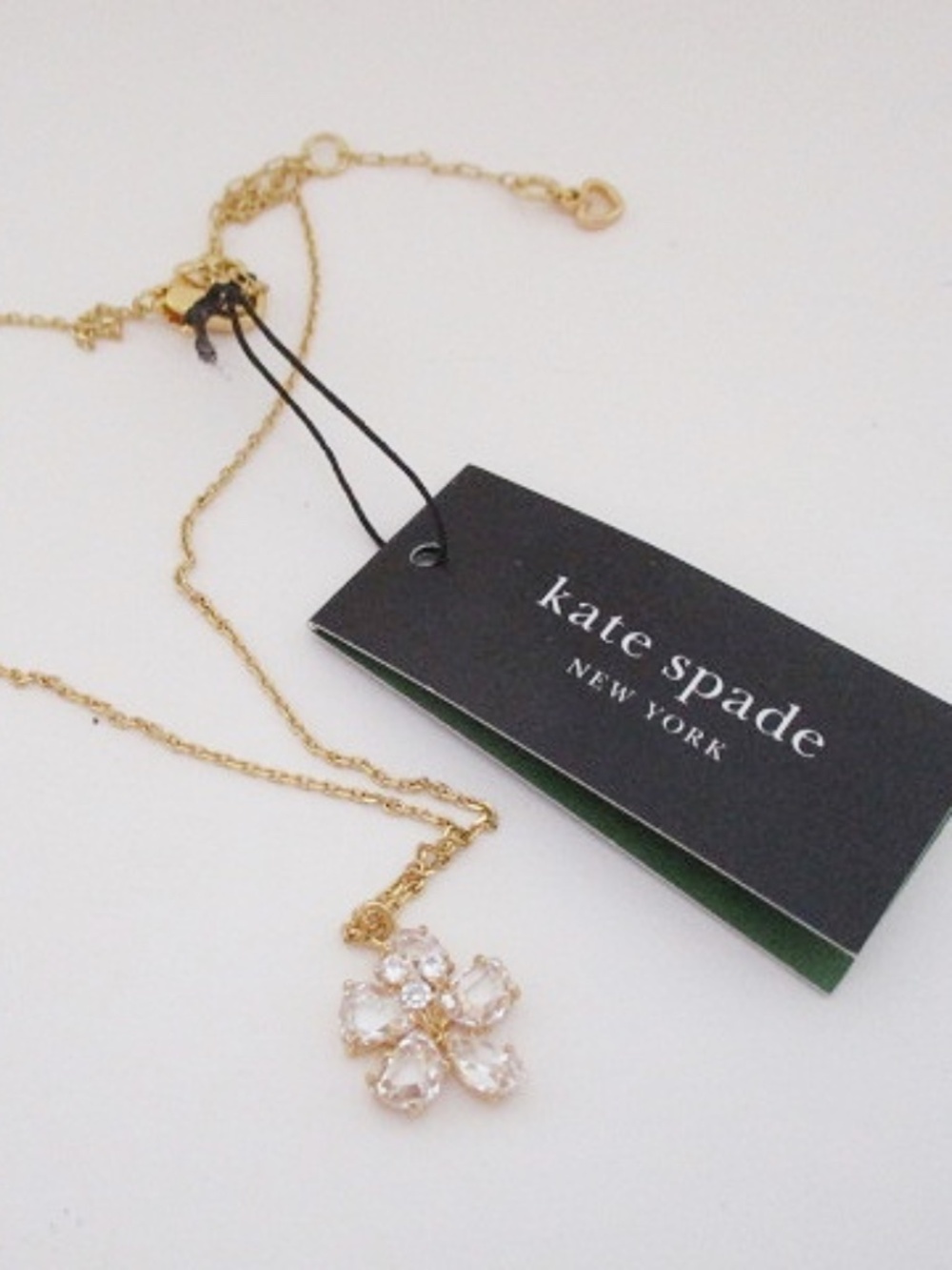 KATE SPADE - Gold Tone Paradise Flower Mini Pendant Necklace - Clear Stones